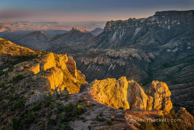 Sunset light captures rock faces of Juniper Canyon at the top of Lost Mine trail. Views across the canyon lead down into Pine Canyon and Sierra del Carmen