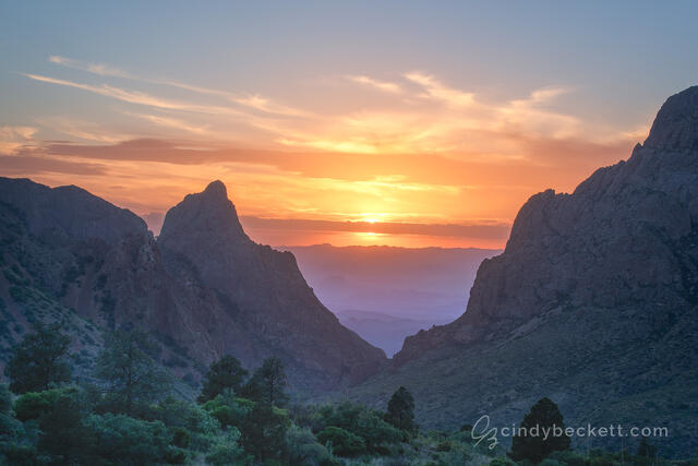 Sunset as viewed through The Window formation from the trail at Chisos Basin in Big Bend National Park.